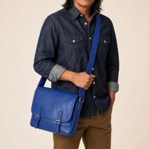 Men's Cobalt Messenger Bag shown with an adult model