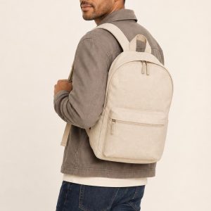 Men's Cream Backpack shown with an adult model