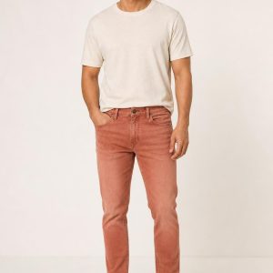Men's Terracotta Faded Wash Tapered Jeans worn with an adult model