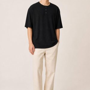 Men's Black Henley Tee worn with an adult model