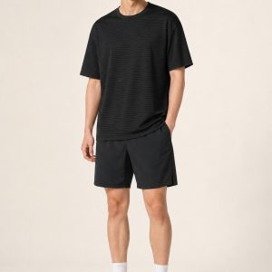 Men's Black Fine Stripe Performance Tee worn with an adult model