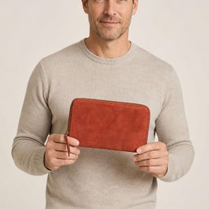 Men's Terracotta Travel Wallet shown with an adult model