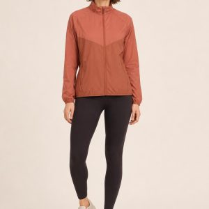 Women's Terracotta Tonal Panel Running Jacket worn with an adult model