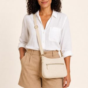 Women's Cream Crossbody Bag shown with an adult model