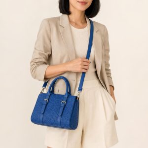 Women's Cobalt Satchel shown with an adult model