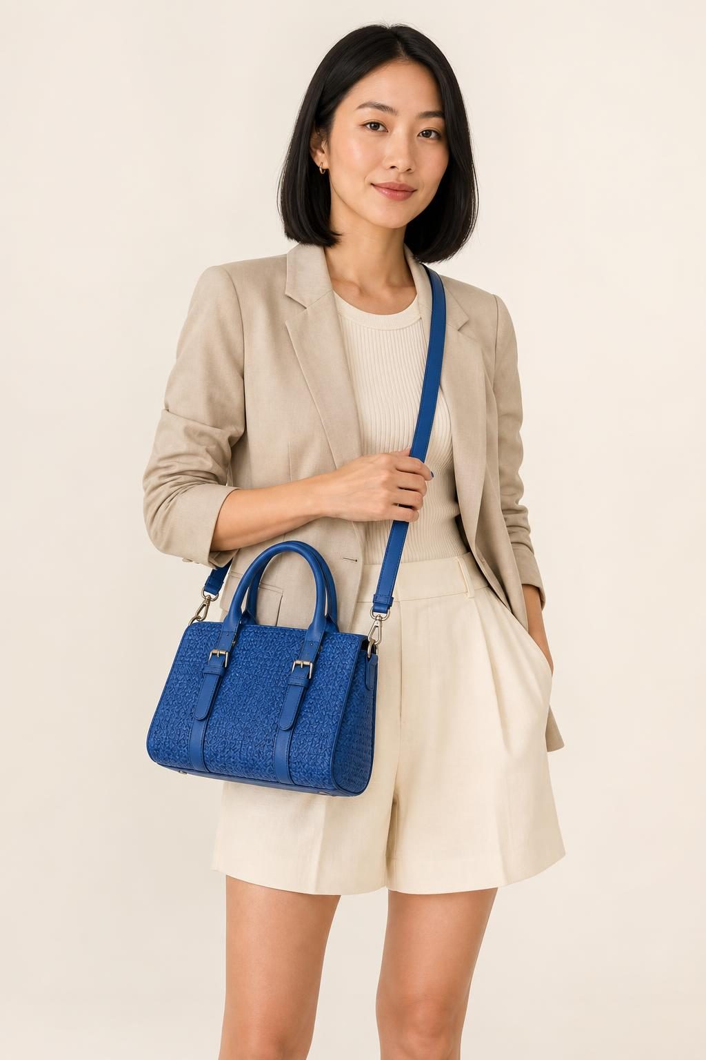 Women's Cobalt Satchel shown with an adult model