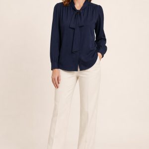 Women's Navy Tie-Neck Blouse worn with an adult model