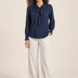 Women's Navy Tonal Texture Tie-Neck Blouse worn with an adult model