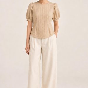Women's Sand Tonal Texture Puff-Sleeve Blouse worn with an adult model