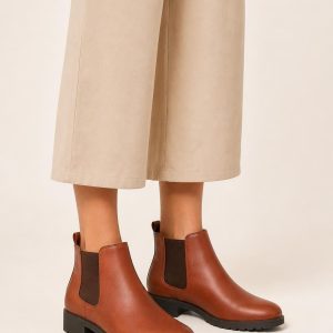 Women's Rust Chelsea Boot worn with an adult model