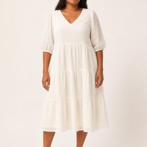 Ivory Swiss-Dot Tiered Dress worn by an adult model