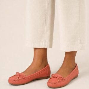 Women's Coral Moccasin Flat worn with an adult model