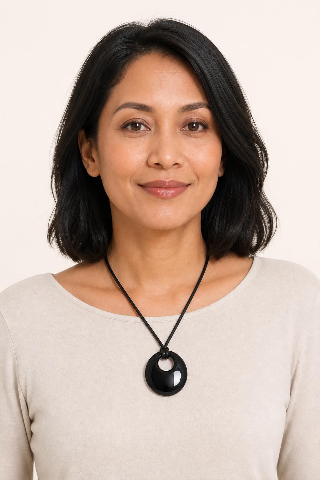 Women's Black Pendant Necklace worn with an adult model