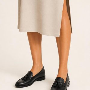 Women's Black Tassel Loafer worn with an adult model