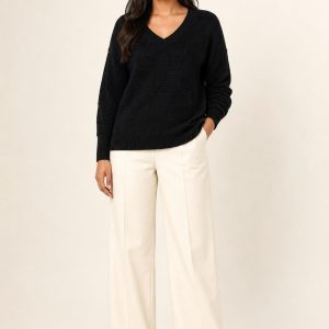 Women's Black Tonal Texture V-Neck Sweater worn with an adult model