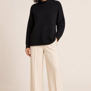 Women's Black Tonal Texture Funnel-Neck Sweater worn with an adult model