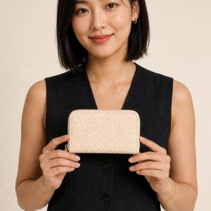 Women's Ivory Zip Wallet shown with an adult model