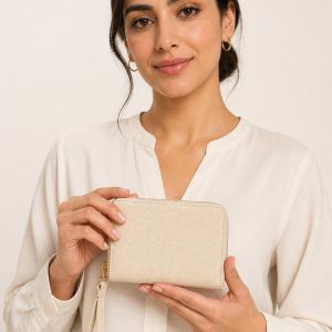 Women's Ivory Wristlet Wallet shown with an adult model